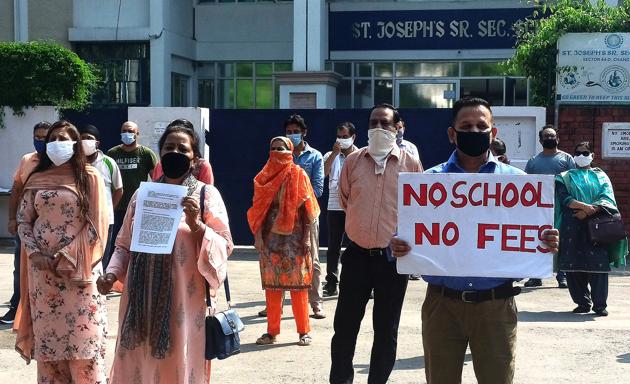 Parents protesting outside St Joseph’s Senior Secondary School in Sector 44, Chandigarh, on Monday.(KESHAV SINGH/HT) Parents protesting outside St Joseph’s Senior Secondary School in Sector 44, Chandigarh, on Monday.(KESHAV SINGH/HT)