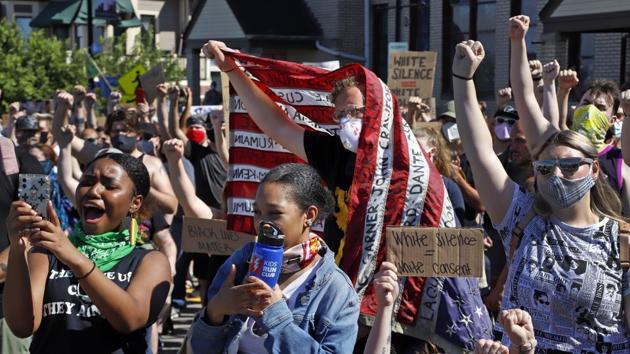 People participate in a Black Lives Matter rally on Mount Washington in Pittsburgh on Sunday, June 7, 2020, during a protest over the death of George Floyd, who died May 25 after being restrained by police in Minneapolis. (AP) People participate in a Black Lives Matter rally on Mount Washington in Pittsburgh on Sunday, June 7, 2020, during a protest over the death of George Floyd, who died May 25 after being restrained by police in Minneapolis. (AP)