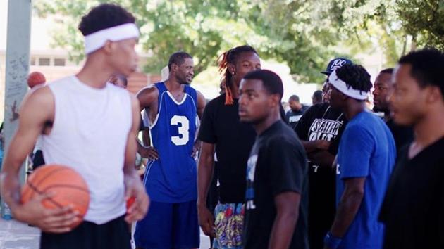 This undated photo released courtesy of Victoria Hernandez of Resurrection Houston Church shows George Floyd (centre) wearing jersey #3 while playing basketball with friends in Houston, Texas. Following Floyd’s death on May 25 and the protests that have followed in the weeks after, the state of Minnesota launched a civil rights investigation of the department , and the first concrete changes came on June 5 in a stipulated agreement in which the city agreed to ban chokeholds and neck restraints. (AFP PHOTO / Resurrection Houston / Nijalon Dunn )