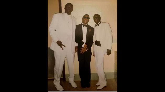 This undated photo of George Floyd (L) was released courtesy his high school friend Mallory Jackson on June 7. Nine of the Minneapolis city council’s 12 members appeared with activists at a rally in a city park Sunday afternoon and vowed to end policing as the city currently knows it. “It is clear that our system of policing is not keeping our communities safe,” Lisa Bender, the council president said. (Family Handout / AFP)
