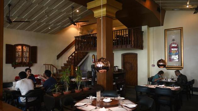 Visitors enjoy their meal at BarBQ restaurant in Park Street, Kolkata. Most economic activities reopened on June 8 outside containment zones in the country’s big urban centres, including Delhi, Kolkata, Bengaluru and Hyderabad. However, Chennai, Mumbai and Gurugram will continue to see restrictions in view of mounting cases of Covid-19. (Samir Jana / HT Photo) 