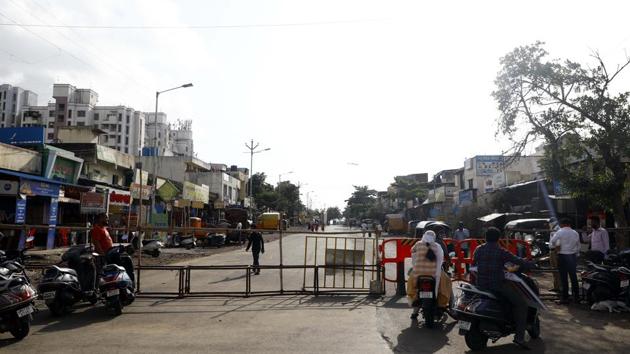 Barricades placed at an entry to the Upper Indiranagar area that has been sealed in Pune, Maharashtra, India, on Saturday, June 6.(Rahul Raut/HT)