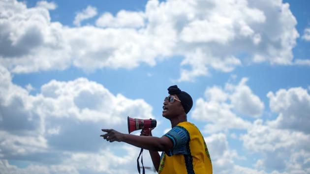 A man speaks at a “Sit In Protest” to mourn the death of George Floyd at DeepWater Park in Pasadena, Texas on June 7. Disbanding an entire police department has happened before. In 2012, with crime rampant in Camden, New Jersey, the city disbanded its police department and replaced it with a new force that covered Camden County. Compton, California, took the same step in 2000. (Mark Felix / AFP)