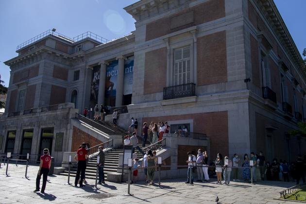 Visitors queue to enter the Prado museum in Madrid, Spain, Saturday, June 6, 2020. Madrid's Museo del Prado opened its doors on Saturday for 1,800 visitors, after its closing during the coronavirus pandemic. The visitors were required to wear face masks and have their temperature taken before taking in what the museum called its "most iconic works". (AP Photo/Manu Fernandez) (AP) Visitors queue to enter the Prado museum in Madrid, Spain, Saturday, June 6, 2020. Madrid's Museo del Prado opened its doors on Saturday for 1,800 visitors, after its closing during the coronavirus pandemic. The visitors were required to wear face masks and have their temperature taken before taking in what the museum called its "most iconic works". (AP Photo/Manu Fernandez) (AP)