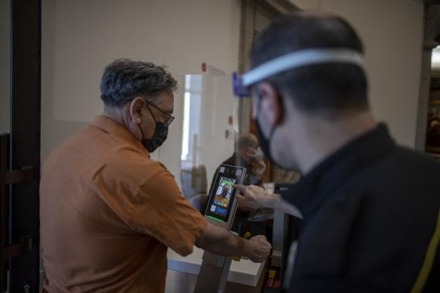 A man has his body temperature checked at the reopening of the Prado museum to the public in Madrid, Spain, Saturday, June 6, 2020. Madrid's Museo del Prado opened its doors on Saturday for 1,800 visitors, after its closing during the coronavirus pandemic. The visitors were required to wear face masks and have their temperature taken before taking in what the museum called its "most iconic works". (AP Photo/Manu Fernandez) (AP) A man has his body temperature checked at the reopening of the Prado museum to the public in Madrid, Spain, Saturday, June 6, 2020. Madrid's Museo del Prado opened its doors on Saturday for 1,800 visitors, after its closing during the coronavirus pandemic. The visitors were required to wear face masks and have their temperature taken before taking in what the museum called its "most iconic works". (AP Photo/Manu Fernandez) (AP)