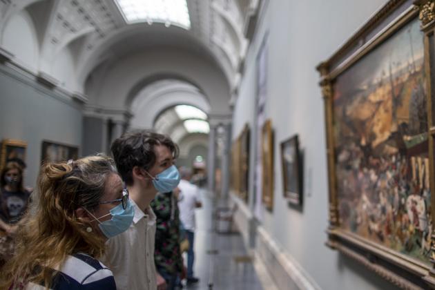 Visitors attend the reopening of the Prado museum to the public in Madrid, Spain, Saturday, June 6, 2020. Madrid's Museo del Prado opened its doors on Saturday for 1,800 visitors, after its closing during the coronavirus pandemic. The visitors were required to wear face masks and have their temperature taken before taking in what the museum called its "most iconic works". (AP Photo/Manu Fernandez) (AP) Visitors attend the reopening of the Prado museum to the public in Madrid, Spain, Saturday, June 6, 2020. Madrid's Museo del Prado opened its doors on Saturday for 1,800 visitors, after its closing during the coronavirus pandemic. The visitors were required to wear face masks and have their temperature taken before taking in what the museum called its "most iconic works". (AP Photo/Manu Fernandez) (AP)