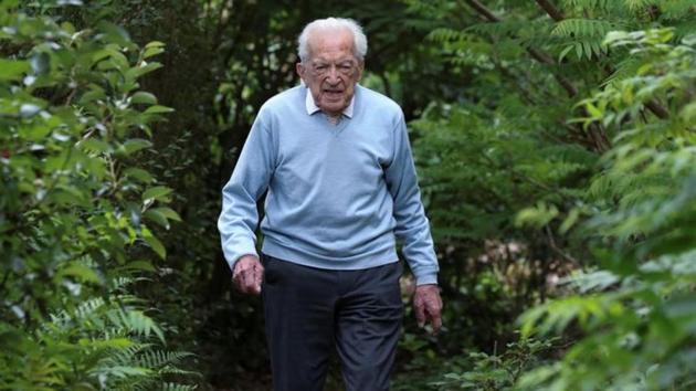 103-year-old Belgian oldest former general practitioner Alfons Leempoels walks in his garden intending to cover a distance equivalent of a marathon to raise money for scientists researching the coronavirus disease (Covid-19) in Rotselaar, Belgium June 9, 2020.(Reuters photo) 103-year-old Belgian oldest former general practitioner Alfons Leempoels walks in his garden intending to cover a distance equivalent of a marathon to raise money for scientists researching the coronavirus disease (Covid-19) in Rotselaar, Belgium June 9, 2020.(Reuters photo)