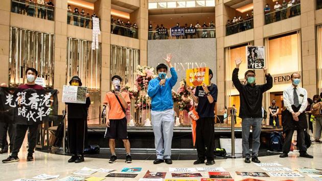People attend a “Lunch With You” rally inside a shopping mall on June 9. Flash-mob protests were held during the lunchtime break in multiple malls even though the crowds were just a few hundred strong. (Anthony Wallace / AFP)