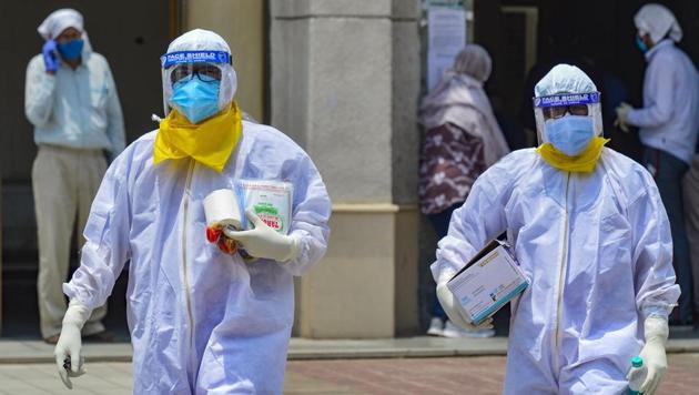 Medics take samples of suspected Covid-19 patients for lab test at a government hospital, during the ongoing nationwide lockdown to curb spread of coronavirus, in New Delhi, Tuesday, June 9, 2020.(PTI photo)