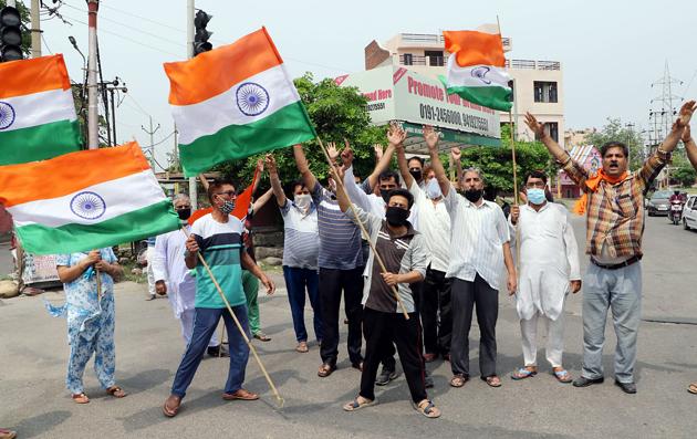 Kashmiri Pandits in Jammu protesting killing of a Kashmiri Sarpanch at Anantnag. (ANI) Kashmiri Pandits in Jammu protesting killing of a Kashmiri Sarpanch at Anantnag. (ANI)