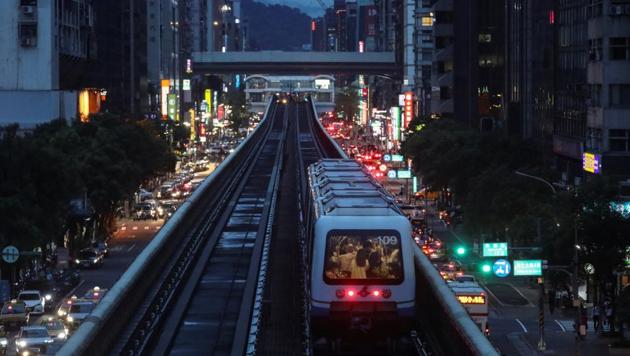 A train approaches a metro station at sunset in Taipei, Taiwan. Earlier in the morning, an US C-40 military transport aircraft was identified flying over the west coastline of Taiwan. (REUTERS) A train approaches a metro station at sunset in Taipei, Taiwan. Earlier in the morning, an US C-40 military transport aircraft was identified flying over the west coastline of Taiwan. (REUTERS)