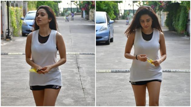 Nushrat Bharucha steps out sans a face mask. She was dressed in a white tank top and black cycling shorts. (Varinder Chawla)