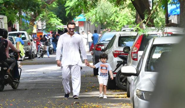 As the restrictions of the two-month nationwide lockdown are slowly relaxed, Bollywood celebrities stepped out of their houses for a breath of fresh air. Saif Ali Khan was spotted taking a walk with son Taimur. (Varinder Chawla)