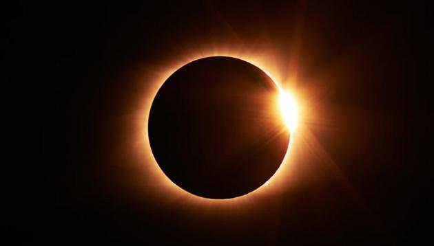 A solar eclipse, or Surya Grahan, is when the Earth gets engulfed in the shadow the moon casts when it covers the sun, either fully or partially blocking sunlight.(Unsplash)