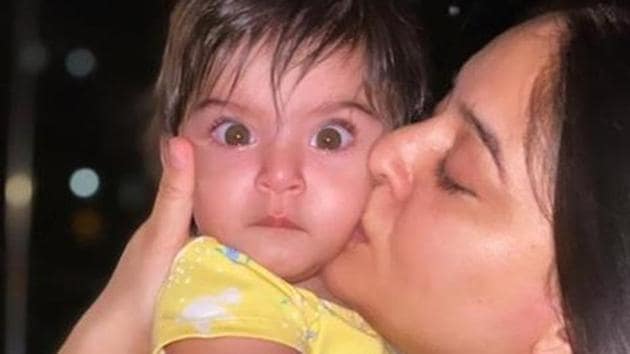 Mahhi Vij kisses her daughter. Mahhi Vij kisses her daughter.