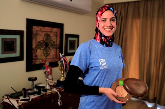 Hedaya Malak Wahba, Egyptian Taekwondo practitioner poses for a photograph with her 2016 Rio Olympics bronze medal and trophies at her home as she trains for the postponed Tokyo Olympic Games amid the spread of the coronavirus disease (COVID-19), in Cairo, Egypt June 4, 2020. Picture taken June 4, 2020. REUTERS/Amr Abdallah Dalsh (REUTERS)
