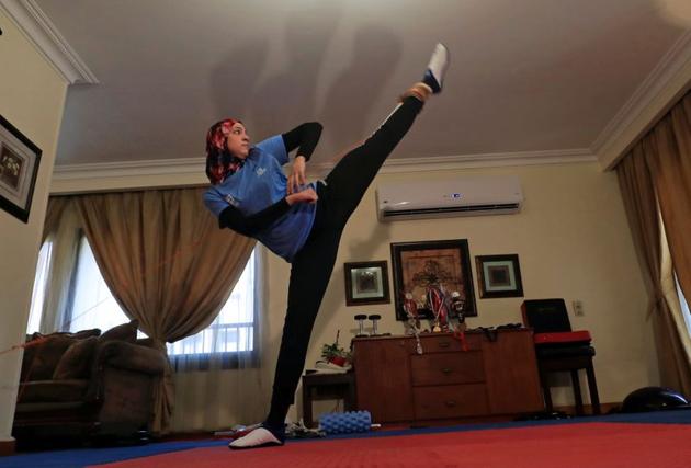 Hedaya Malak Wahba, Egyptian Taekwondo practitioner and 2016 Rio Olympics bronze medallist, works out at her home as she trains for the postponed Tokyo Olympic Games amid the spread of the coronavirus disease (COVID-19), in Cairo, Egypt June 4, 2020. Picture taken June 4, 2020. REUTERS/Amr Abdallah Dalsh (REUTERS)