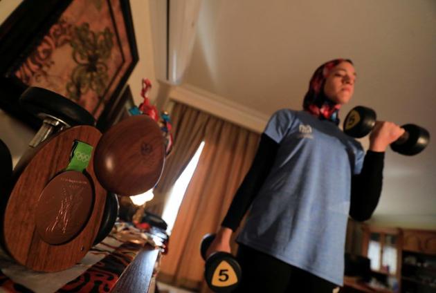 Hedaya Malak Wahba, Egyptian Taekwondo practitioner works out next to her 2016 Rio Olympics bronze medallist at her home as she trains for the postponed Tokyo Olympic Games amid the spread of the coronavirus disease (COVID-19), in Cairo, Egypt June 4, 2020. Picture taken June 4, 2020. REUTERS/Amr Abdallah Dalsh (REUTERS)