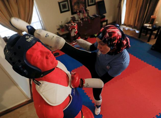 Hedaya Malak Wahba, Egyptian Taekwondo practitioner and 2016 Rio Olympics bronze medallist, works out at her home as she trains for the postponed Tokyo Olympic Games amid the spread of the coronavirus disease (COVID-19), in Cairo, Egypt June 4, 2020. Picture taken June 4, 2020. REUTERS/Amr Abdallah Dalsh (REUTERS)