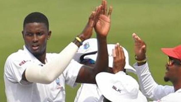 West Indies bowler Jason Holder (C) celebrates the wicket of his Indian batsman Virat Kohli.(PTI)