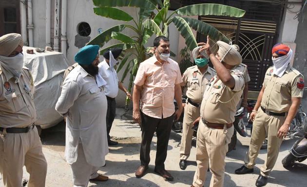 Police investigating the spot in where unidentified assailants opened fire at a murder bid accused in Dharampura, Ludhiana, on Tuesday. (Gurpreet Singh/HT) Police investigating the spot in where unidentified assailants opened fire at a murder bid accused in Dharampura, Ludhiana, on Tuesday. (Gurpreet Singh/HT)
