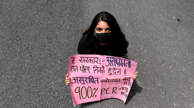 A protester holds a placard during the demonstration in Kathmandu. Nepal imposed a nationwide lockdown on March 24 when the country had two confirmed coronavirus infections. The lockdown is scheduled to be in place until June 14. (Prakash Mathema / AFP) A protester holds a placard during the demonstration in Kathmandu. Nepal imposed a nationwide lockdown on March 24 when the country had two confirmed coronavirus infections. The lockdown is scheduled to be in place until June 14. (Prakash Mathema / AFP)