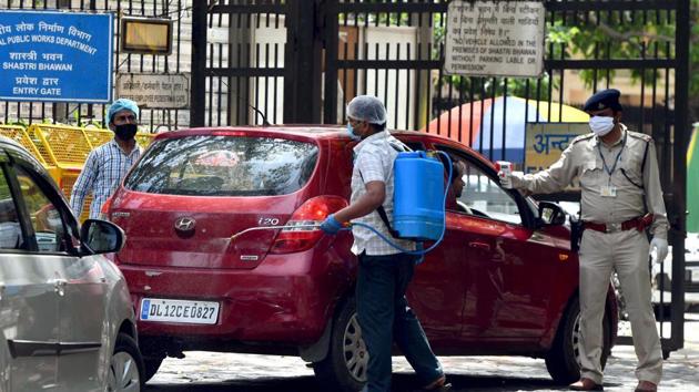 Personnel uses a thermal screening device on a driver at the entrance of Shastri Bhawan as central government offices have resumed working during the ongoing nationwide lockdown amid coronavirus pandemic.(ANI File Photo)