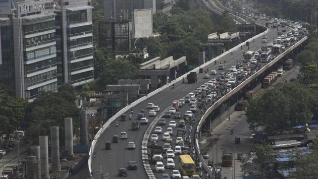 India’s graded exit from lockdown set into motion by ‘Unlock 1.0’ brings with it familiar sights tweaked to life in the times of coronavirus. Among the first to greet cooped up Indians stepping out after months is the return of serpentine traffic seen along the Western Express Highway in Mumbai on June 8. (Satyabrata Tripathy / HT Photo)