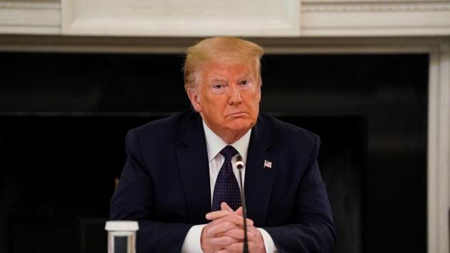 US president Donald Trump listens during a roundtable discussion with law enforcement in the State Dining Room at the White House in Washington on June 8, 2020.(Reuters Photo)
