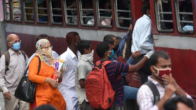 Commuters board a public transport bus at CST as government ease lockdown during Covid-19 pandemic in Mumbai on Wednesday.(Satish Bate/HT Photo)