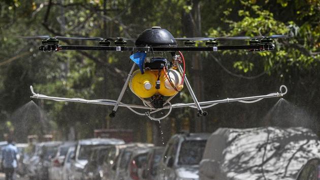 A drone operated by city municipal employees to spray disinfectant during a sanitisation drive at Nizamuddin on April 2. In Nizamuddin, most of the flower and chadar shops (offerings bought by devotees to the dargah) have also remained closed. (Biplov Bhuyan / HT Photo)
