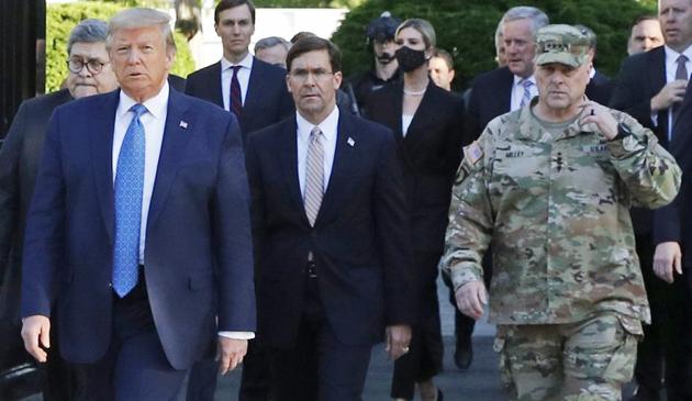 Walking behind Trump from left are, Attorney General William Barr, Secretary of Defense Mark Esper and General Mark Milley, chairman of the Joint Chiefs of Staff. (AP file photo) Walking behind Trump from left are, Attorney General William Barr, Secretary of Defense Mark Esper and General Mark Milley, chairman of the Joint Chiefs of Staff. (AP file photo)