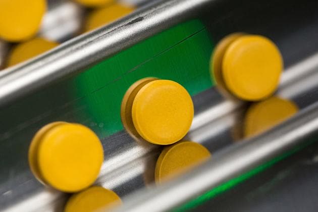 Finished tablets cascade down the channels of a packaging machine during the manufacture of the Favipiravir antiviral medicine, a joint venture between the Russian Direct Investment Fund (RDIF) and ChemRar group, at a plant in Khimki, Russia. (Bloomberg) Finished tablets cascade down the channels of a packaging machine during the manufacture of the Favipiravir antiviral medicine, a joint venture between the Russian Direct Investment Fund (RDIF) and ChemRar group, at a plant in Khimki, Russia. (Bloomberg)