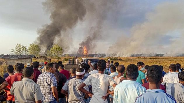 Locals look on as smoke billows from the fire at Baghjan gas field on June 9. There were protests in the area as the fire broke out, threatening the lives and livelihood of people already facing the impact of the blowout for the last two weeks amid the COVID-19 crisis. (PTI) Locals look on as smoke billows from the fire at Baghjan gas field on June 9. There were protests in the area as the fire broke out, threatening the lives and livelihood of people already facing the impact of the blowout for the last two weeks amid the COVID-19 crisis. (PTI)