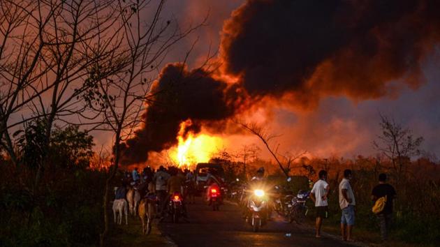 Smoke billows from a the fire on June 9. OIL has said the foreign experts have expressed confidence about controlling the fire and capping the well safely but the operation requires a large amount of water, installation of high discharge pumps, and removal of debris which will take weeks. (PTI) Smoke billows from a the fire on June 9. OIL has said the foreign experts have expressed confidence about controlling the fire and capping the well safely but the operation requires a large amount of water, installation of high discharge pumps, and removal of debris which will take weeks. (PTI)