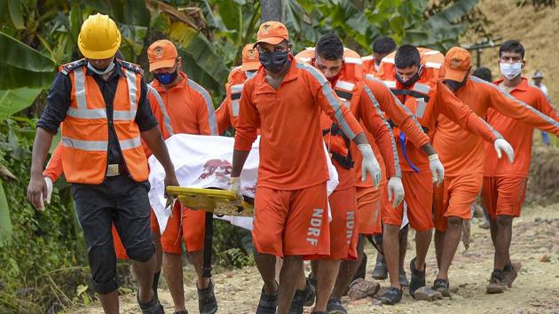 NDRF personnel carry the bodies of two firemen who had gone missing after the explosion at Baghjan gas field on June 10. Durlov Gogoi, a former national level footballer, and Tikheswar Gohain, 56 were working to control the blowout, or leakage of gas and condensate, from the well when it caught fire. (PTI) NDRF personnel carry the bodies of two firemen who had gone missing after the explosion at Baghjan gas field on June 10. Durlov Gogoi, a former national level footballer, and Tikheswar Gohain, 56 were working to control the blowout, or leakage of gas and condensate, from the well when it caught fire. (PTI)