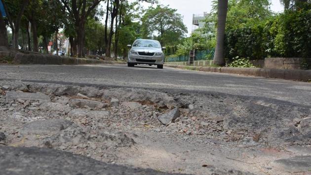 A damaged section of a road in Panchkula’s Sector 7. (Sant Arora/HT) A damaged section of a road in Panchkula’s Sector 7. (Sant Arora/HT)