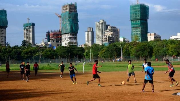 Young men play football in the Shivaji Park ground after an ease in lockdown restrictions allowed public to venture outdoors, on June 9. However, with dense crowds in open spaces and non-adherence to social distancing norms, Maharashtra government is set to review the relaxations across the state. (Satish Bate / HT Photo) Young men play football in the Shivaji Park ground after an ease in lockdown restrictions allowed public to venture outdoors, on June 9. However, with dense crowds in open spaces and non-adherence to social distancing norms, Maharashtra government is set to review the relaxations across the state. (Satish Bate / HT Photo)