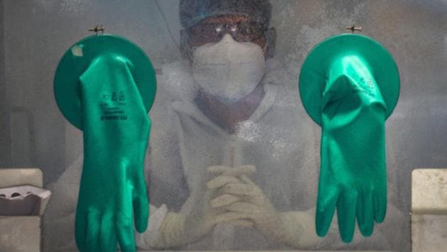 A medic sits inside a Walk-In Sample Kiosk (WISK) waiting to collect swab samples for COVID-19 test at a government hospital in New Delhi. The death toll in Delhi due to the coronavirus disease (Covid-19) soared past the 1,000 mark on June 11 as the city recorded 1,877 new infections and 101 new fatalities. (Kamal Kishore / PTI) A medic sits inside a Walk-In Sample Kiosk (WISK) waiting to collect swab samples for COVID-19 test at a government hospital in New Delhi. The death toll in Delhi due to the coronavirus disease (Covid-19) soared past the 1,000 mark on June 11 as the city recorded 1,877 new infections and 101 new fatalities. (Kamal Kishore / PTI)