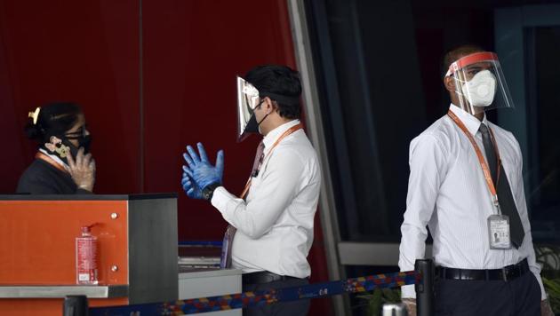 Air India ground staff in face shields, masks and gloves at T3 Indira Gandhi International (IGI) Airport in New Delhi on May 23, 2020. (Sanjeev Verma/HT File Photo) Air India ground staff in face shields, masks and gloves at T3 Indira Gandhi International (IGI) Airport in New Delhi on May 23, 2020. (Sanjeev Verma/HT File Photo)