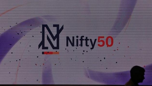 A man walks past a new brand identity for Nifty Indices inside the National Stock Exchange (NSE) building in Mumbai. (REUTERS) A man walks past a new brand identity for Nifty Indices inside the National Stock Exchange (NSE) building in Mumbai. (REUTERS)