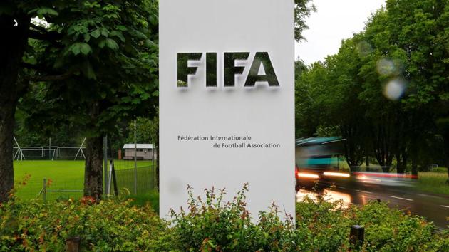 FILE PHOTO: Cars drive past a logo in front of FIFA's headquarters in Zurich, Switzerland June 8, 2016. REUTERS/Arnd Wiegmann/File Photo (REUTERS) FILE PHOTO: Cars drive past a logo in front of FIFA's headquarters in Zurich, Switzerland June 8, 2016. REUTERS/Arnd Wiegmann/File Photo (REUTERS)