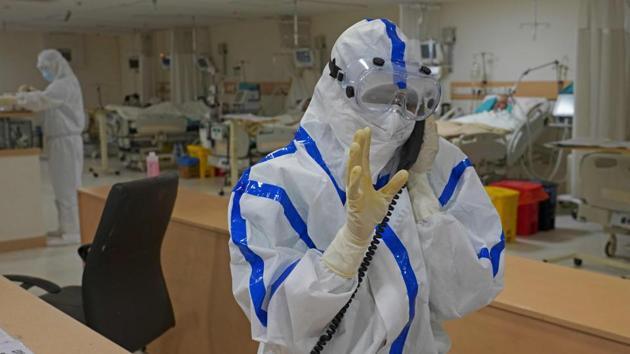A medical professional speaks on a phone inside the COVID-19 intensive care unit (ICU) of Max Smart Super Speciality Hospital in New Delhi. According to the health bulletin, the number of active infections is 20,871, of which nearly 78% are in home isolation that is available as a treatment option for those with mild or asymptomatic illness. (Abhaya Srivastava / AFP) A medical professional speaks on a phone inside the COVID-19 intensive care unit (ICU) of Max Smart Super Speciality Hospital in New Delhi. According to the health bulletin, the number of active infections is 20,871, of which nearly 78% are in home isolation that is available as a treatment option for those with mild or asymptomatic illness. (Abhaya Srivastava / AFP)