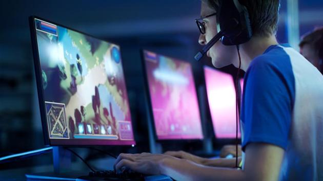 Team of Professional eSport Gamers Playing in Competitive MMORPG/ Strategy Video Game on a Cyber Games Tournament. They Talk to Each other into Microphones.(Getty Images/iStockphoto)