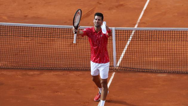 Serbia's Novak Djokovic celebrates after winning his match against Serbia's Viktor Troicki.(REUTERS)