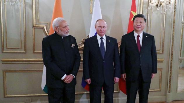 Prime Minister Narendra Modi (L), Russia's President Vladimir Putin (C) and China's President Xi Jinping, pose for pictures during a meeting in the sidelines of the G20 Summit in Buenos Aires, on November 30, 2018.(AFP/ File photo)