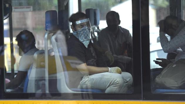 A commuter wears a face shield inside a bus at ITO, New Delhi on June 11. More than 57% of all cases in India can be traced to just three states – Maharashtra, Delhi and Tamil Nadu — a fact that highlights how the spread of the virus in the country has largely been centered in a handful of hot spot regions. (Arvind Yadav / HT Photo) A commuter wears a face shield inside a bus at ITO, New Delhi on June 11. More than 57% of all cases in India can be traced to just three states – Maharashtra, Delhi and Tamil Nadu — a fact that highlights how the spread of the virus in the country has largely been centered in a handful of hot spot regions. (Arvind Yadav / HT Photo)