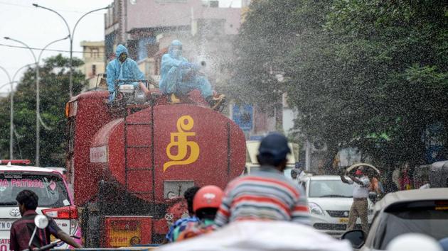 A firefighter sprays disinfectant on commuters in Chennai. The city has reported over 27,000 cases, which is around 70% of total Covid-19 cases in Tamil Nadu. As of June 13, the number of coronavirus cases in the state stood at 40,698, reported HT. (Arun Sankar / AFP) A firefighter sprays disinfectant on commuters in Chennai. The city has reported over 27,000 cases, which is around 70% of total Covid-19 cases in Tamil Nadu. As of June 13, the number of coronavirus cases in the state stood at 40,698, reported HT. (Arun Sankar / AFP)