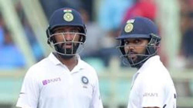 India's Rohit Sharma, right, and Cheteshwar Pujara (AP) India's Rohit Sharma, right, and Cheteshwar Pujara (AP)
