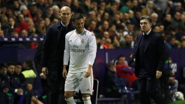 Real Madrid Eden Hazard reacts after he was substituted as coach Zinedine Zidane looks on.(REUTERS) Real Madrid Eden Hazard reacts after he was substituted as coach Zinedine Zidane looks on.(REUTERS)